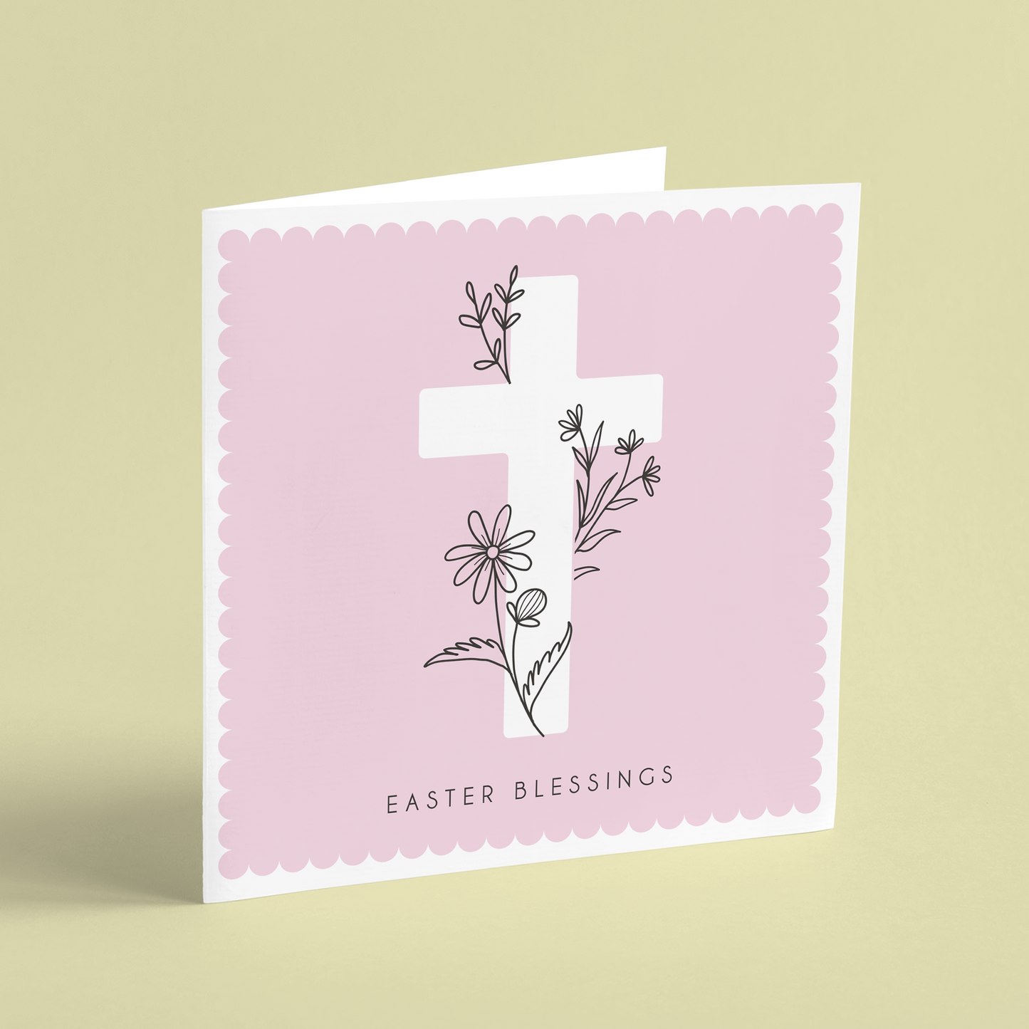 A square Easter card featuring a white cross on a pink background illustrated with floral outlines and reading 'Easter Blessings'.